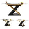 A dining table with a white marble top and black and gold X-shaped legs, shown in three different configurations. Podgląd zdjęcia produktu