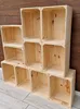 A stack of wooden crates against a wooden wall and on a wooden floor. Náhled obrázku produktu