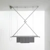 A ceiling-mounted clothes drying rack with towels hanging from it. Anteprima dell’immagine prodotto