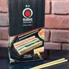 A close-up shot of a Sushi Sensei deluxe edition sushi making kit box, with chopsticks and ingredients visible. Náhľad obrázku produktu