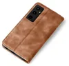A brown leather flip case for a smartphone is shown against a white background. Produktbild-Vorschau