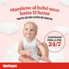 A baby is sitting on a fluffy white surface, surrounded by clouds, with marketing text about Huggies diapers. Náhľad obrázku produktu