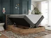A bedroom scene with a bed that has its storage compartment open. Produktbild-Vorschau
