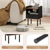 A nightstand next to a sofa with a robot vacuum cleaner on the floor. Náhled obrázku produktu