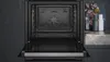 An open oven with a dark interior and a glass door in the foreground. Produktbild-Vorschau