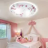 A child's bedroom with a bed, window, and a ceiling light. Produktbild-Vorschau