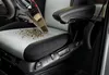 A handheld vacuum cleaner is being used to clean dirt and debris from a car seat. Podgląd zdjęcia produktu