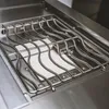 A close-up view of the cooking grates and burner cover of a gas grill. Anteprima dell’immagine prodotto