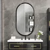 A modern bathroom vanity with a mirror, sink, and toiletries. Náhled obrázku produktu
