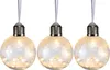 Three decorative LED light-up baubles shaped like light bulbs, hanging from white ribbons against a white background. Produktbild-Vorschau