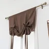 A brown tie-up valance curtain hanging on a curtain rod above a window. Náhled obrázku produktu