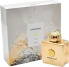 A gold-colored perfume bottle and its packaging are displayed. Podgląd zdjęcia produktu