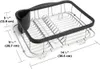 A close-up view of a metal dish rack with a black plastic utensil holder, with dimensions indicated by measurement lines and text. Produktbild-Vorschau