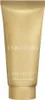 A golden tube of body lotion. Podgląd zdjęcia produktu