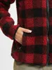 Close-up of a person's hand in the pocket of a red and black checkered fleece jacket. Produktbild-Vorschau