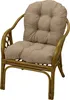 A rattan armchair with a thick, tufted cushion. Produktbild-Vorschau
