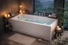 A luxurious bathroom with a bathtub filled with water, overlooking a lush green forest. Produktbild-Vorschau