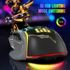 A gaming mouse with RGB lighting and a robot figurine in the background. Produktbild-Vorschau