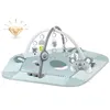 A baby play mat with arches and hanging toys, featuring a koala theme. Voir les images du produit