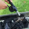A hand is using a charcoal blower to ignite charcoal in a grill. Náhľad obrázku produktu