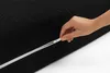 A hand is shown zipping up a black mattress cover. Produktbild-Vorschau