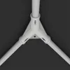 A close-up view of a white plastic connector for tent poles, showing three poles joined together in a triangular configuration. Produktbild-Vorschau