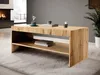 A modern wooden coffee table in a living room setting with a fireplace and plant. Anteprima dell’immagine prodotto