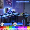 A gaming desk setup with RGB LED lighting, monitors, a laptop, and computer tower. Anteprima dell’immagine prodotto