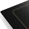 A close-up, angled view of a black induction cooktop with gold decorative lines. Produktbild-Vorschau