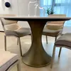 A dining table and chairs in a modern setting. Produktbild-Vorschau