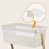 A close-up view of a baby bassinet with an inset showing a detail of its construction. Produktbild-Vorschau