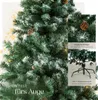 A close-up view of a decorated artificial Christmas tree with text overlays highlighting its features. Produktbild-Vorschau