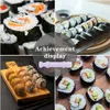 A collage of images showing sushi and a sushi-making tool. Náhled obrázku produktu