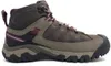 A side view of a brown and gray hiking boot. Voir les images du produit