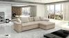 A modern living room with a large sectional sofa, a coffee table, and large windows overlooking a city view. Náhled obrázku produktu