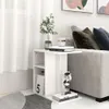 A white side table with books and a decorative item next to a sofa. Anteprima dell’immagine prodotto
