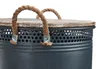 Close-up of the top part of a laundry basket, showing the lid, handles, and upper rim. Produktbild-Vorschau