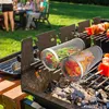 A barbecue scene with people in the background and grilling accessories in the foreground. Produktbild-Vorschau