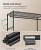 A close-up view of a black metal garment rack with shelves, highlighting its stability and material. Produktbild-Vorschau