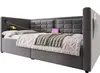 A grey upholstered bed with a tufted headboard, shown with bedding and a tablet charging. Anteprima dell’immagine prodotto
