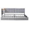 A light gray upholstered bed frame with a wooden headboard accent, shown from the side against a white background. Anteprima dell’immagine prodotto