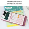 A pink scientific calculator is shown on top of books, with text overlays highlighting its features. Podgląd zdjęcia produktu