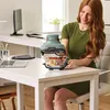 A woman is using a Ninja CRISPi air fryer on a desk in an office setting. Anteprima dell’immagine prodotto