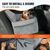 A dog is sitting in a car seat protector in the back seat of a car. The image also shows close-ups of the product's features. Náhľad obrázku produktu