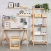A home office setup with a wooden desk, stool, and shelving unit against a white brick wall. Anteprima dell’immagine prodotto