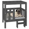 A pug dog lies on a cushion inside a grey wooden dog bed with a small step. Náhľad obrázku produktu