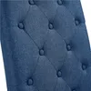 A close-up view of the tufted upholstery of a blue chair. Produktbild-Vorschau