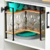 A corner shelf unit with kitchenware inside a cabinet. Náhled obrázku produktu