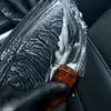 Close-up of a hand in a black glove cleaning car upholstery with a brush and foam. Anteprima dell’immagine prodotto