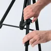Hands adjusting a tripod. Anteprima dell’immagine prodotto
